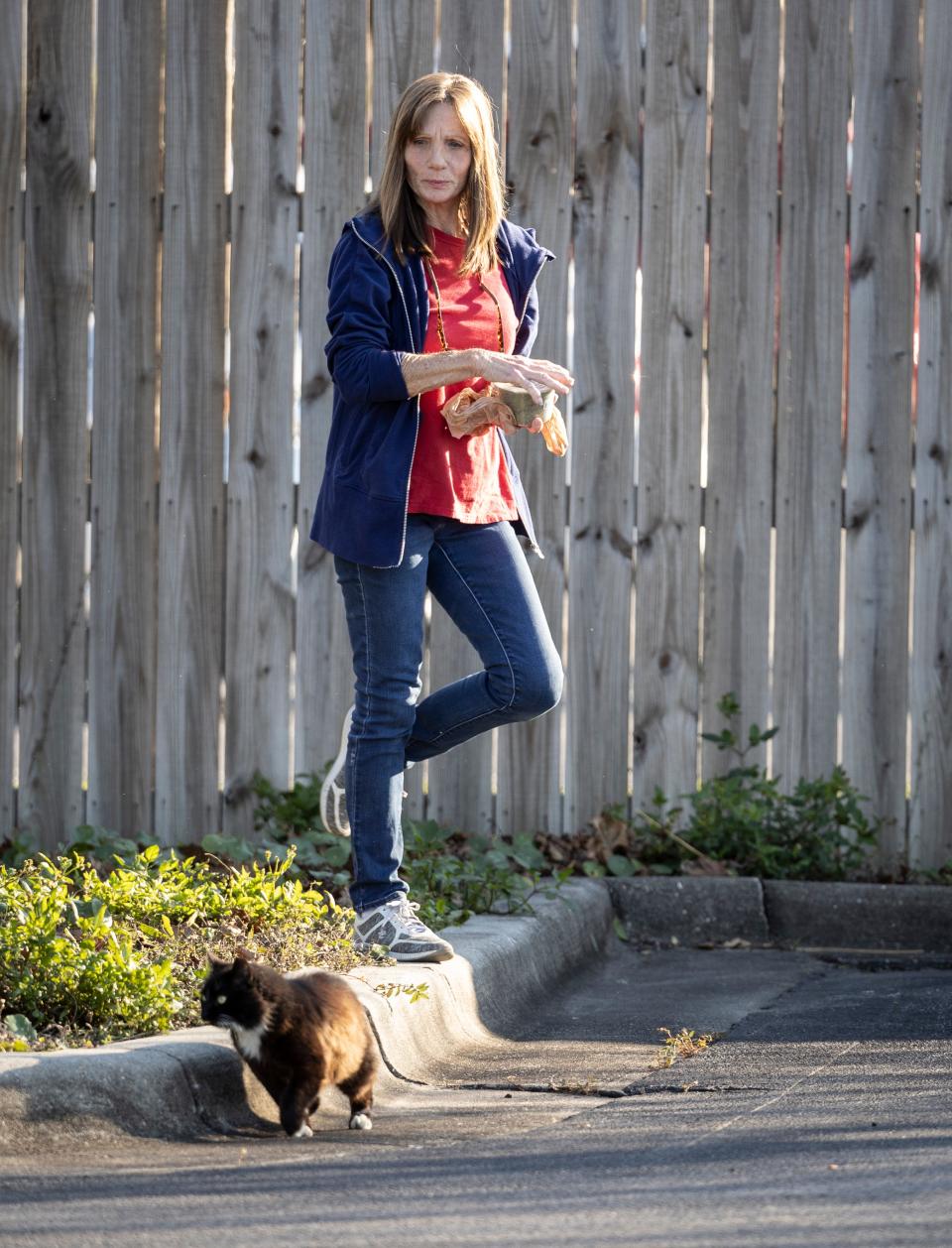 Molly Grady, founder of the Street Cat Society, checks on her cat colonies around Panama City on Jan. 5.