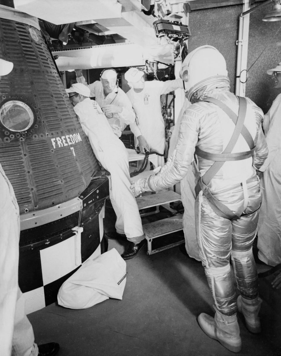 Alan Shepard prepares to board his Freedom 7 capsule. The spacecraft, which took Shepard to suborbital space in May 1961, originally came with portholes for viewing, but those were later changed to a trapezoid-shaped window. For spacecraft builders, putting in windows was once viewed as offensive to an engineer's sense of structural integrity and design elegance. <cite>NASA</cite>