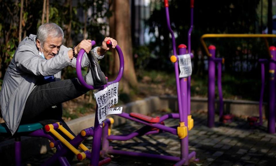 An elderly man works out on an exercise machine at a park in Shanghai.