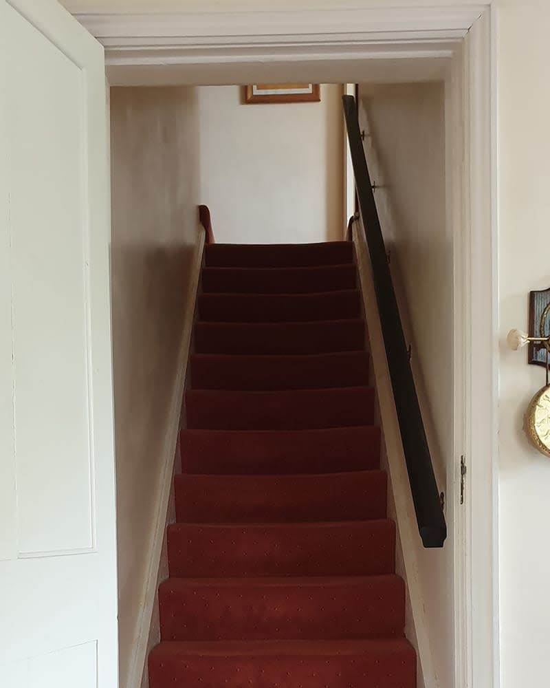 Stairs in living room before renovation.