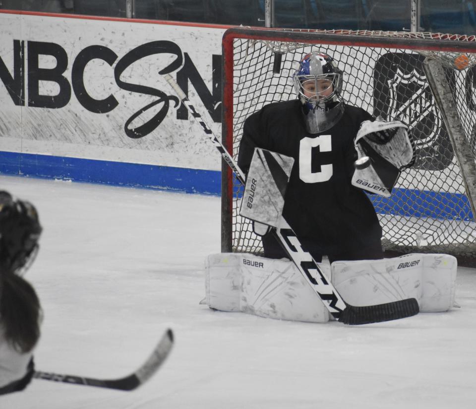 Goaltender Casey Clausen makes a stop during a Clinton practice at Clinton Arena. Clausen has been key for Clinton this season.