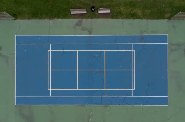 An empty tennis court is seen May 4, 2021 in Ottawa. Outdoor tennis courts are part of the Ontario government's stay-at-home measures.