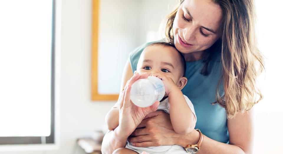 New mum can’t decide whether to ask her smoker mother-in-law to change her clothes and shower before touching her newborn. [Photo: Getty]