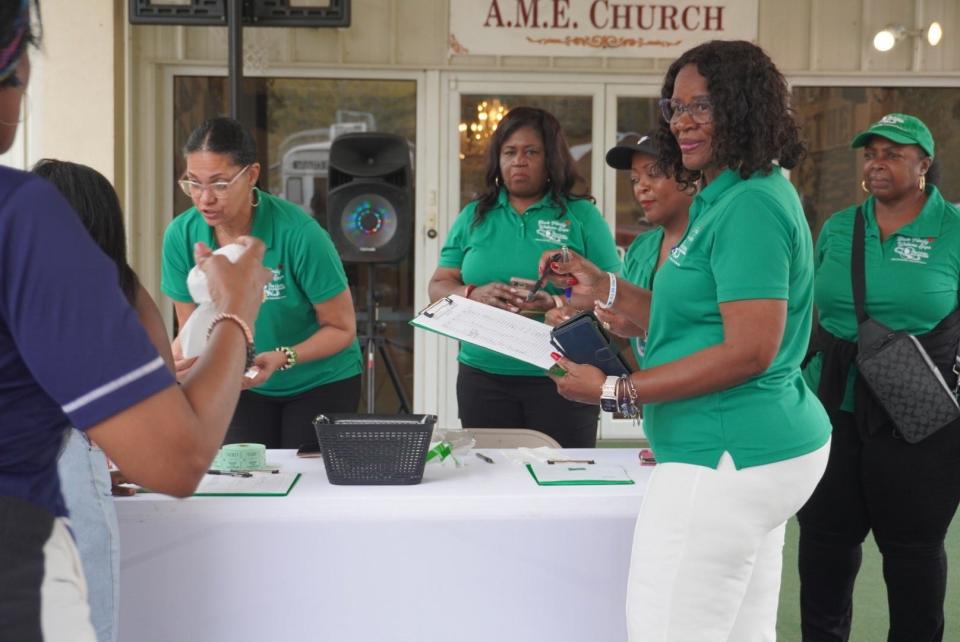 Members of The Gainesville chapter of The Links Inc. register attendees during the Black Family Wellness Expo on Saturday at Greater Bethel AME Church in southeast Gainesville.