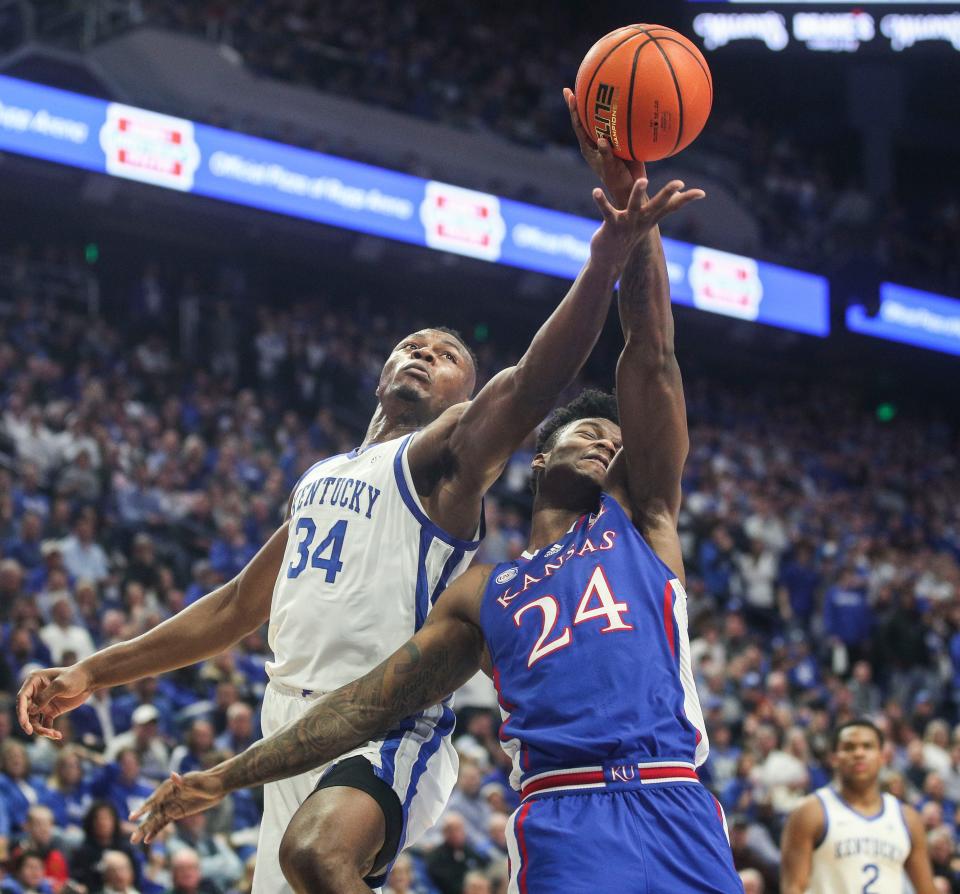 Kentucky forward Oscar Tshiebwe and Kansas forward KJ Adams, Jr. battle for control at Rupp Arena in the first half.  Jayhawks led 41-34 at halftime. Jan. 28, 2023