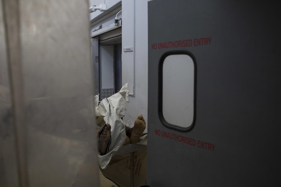 This Sunday, Jan. 28, 2018 photo shows the body of an unidentified man at a mortuary in the Hillbrow neighborhood of Johannesburg. It's South Africa's busiest morgue, with 3,000 bodies being investigated every year. Ten per cent of those remain unclaimed and unidentified. (AP Photo/Bram Janssen)