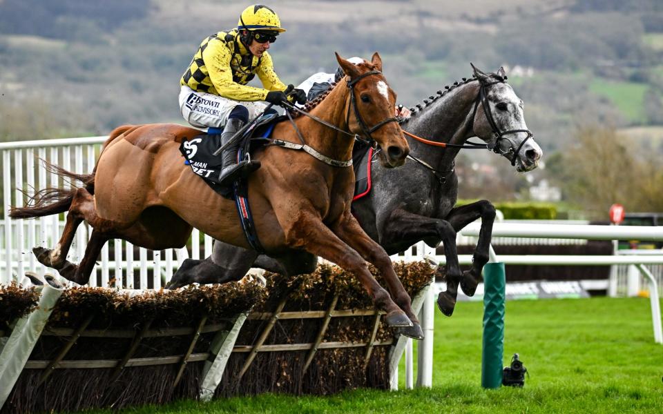 Bravemansgame, with Harry Cobden up, who finished second, as they jump the last, on their way to winning the Boodles Cheltenham Gold Cup Chase