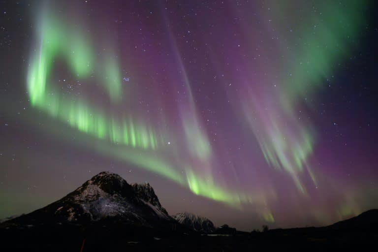 A solar storm could bring auroras -- such as that seen here in Norway on May 10, 2024 -- to night skies where such phenomenon aren't normally visible (Olivier MORIN)