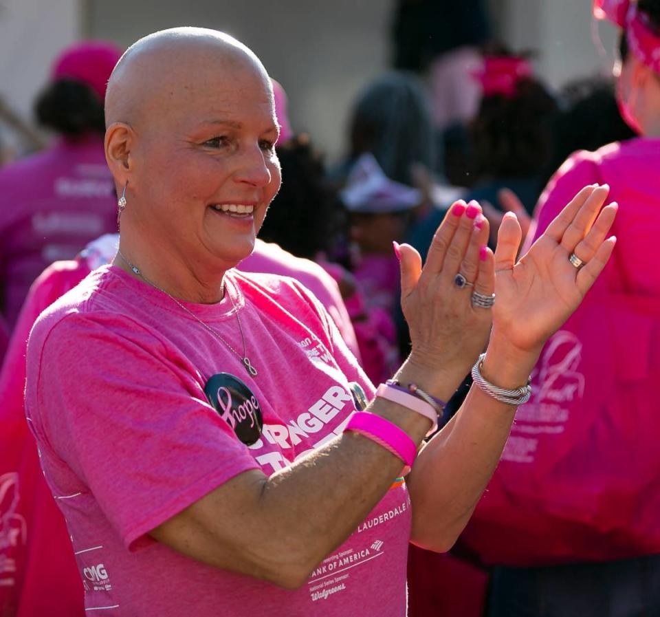 Corinne Blanchard, who has stage 3 breast cancer and has completed her 11th chemotherapy treatment, cheers as she attends the opening ceremony of the Susan G. Komen More Than Pink Walk at Bayfront Park in downtown Miami on Saturday, October 16, 2021. The event aims to raise awareness and money for breast cancer research.