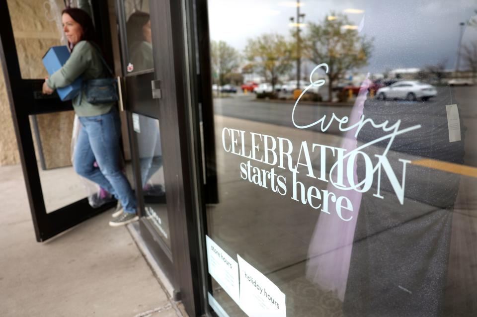 Becky Withers leaves David’s Bridal in Salt Lake City on Tuesday, April 18, 2023. The national wedding dress retailer has filed for bankruptcy, though stores remain open, according to reports. | Kristin Murphy, Deseret News