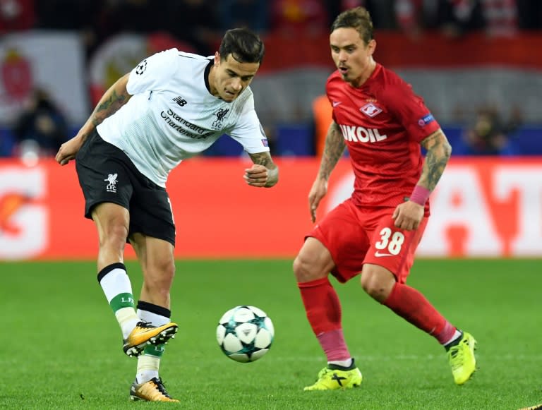 Liverpool's Philippe Coutinho Correia (L) fights for the ball with Spartak Moscow's Andrey Eshchenko during their UEFA Champions League Group E match, at the Otkrytiye Arena stadium in Moscow, on September 26, 2017