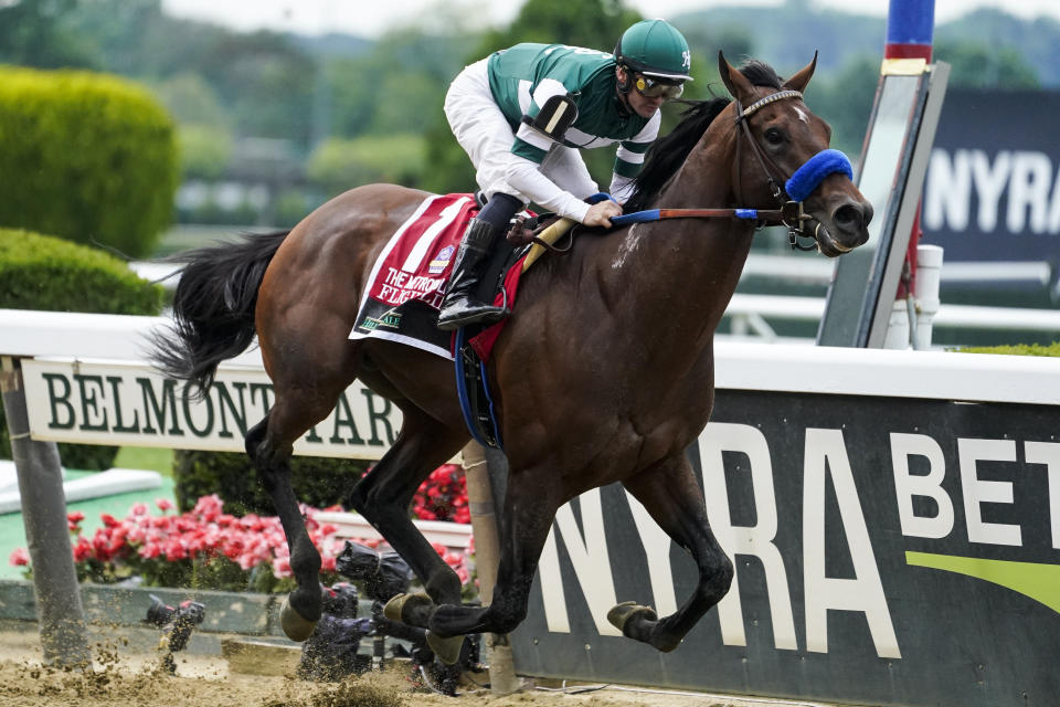 FILE - Flightline, jockey Flavien Prat up, wins The Hill 'N' Dale Metropolitan horse race before the 154th running of the Belmont Stakes horse race, Saturday, June 11, 2022, at Belmont Park in Elmont, N.Y. Undefeated Flightline and Rich Strike, upset winner of the Kentucky Derby, head a field of nine for the Breeders' Cup Classic. (AP Photo/John Minchillo, File)