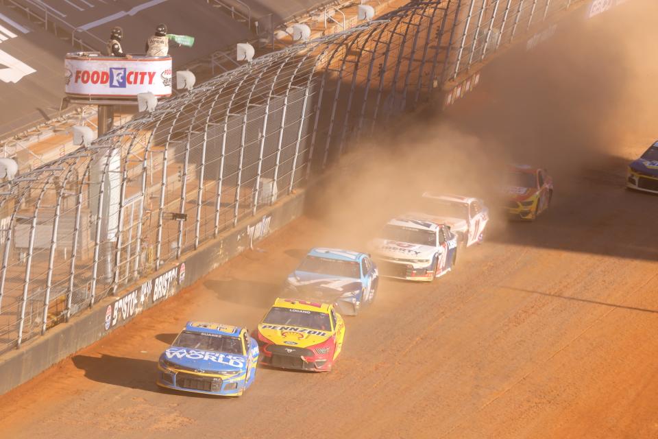 Daniel Suarez (99) and Joey Logano (22) lead a restart during the Food City Dirt Race at Bristol Motor Speedway  on March 29.