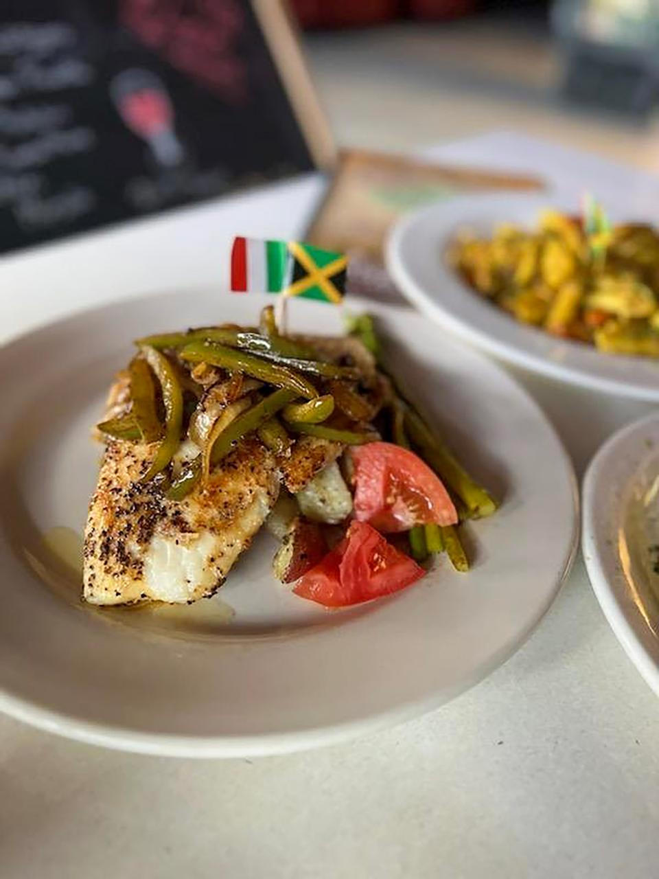 Snapper fish over veggies is one of the Jamaican fusion dishes offer at Naples Italian Restaurant in Leesburg.