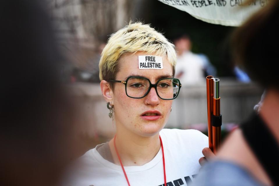 A protester with a “Free Palestine” sticker on her forehead. Matthew McDermott