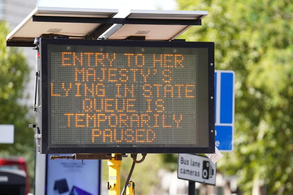 A sign in Bermondsey, south-east London, informing members of the public that the queue to view the Queen lying in state ahead of her funeral on Monday is temporarily paused (James Manning/PA) (PA Wire)