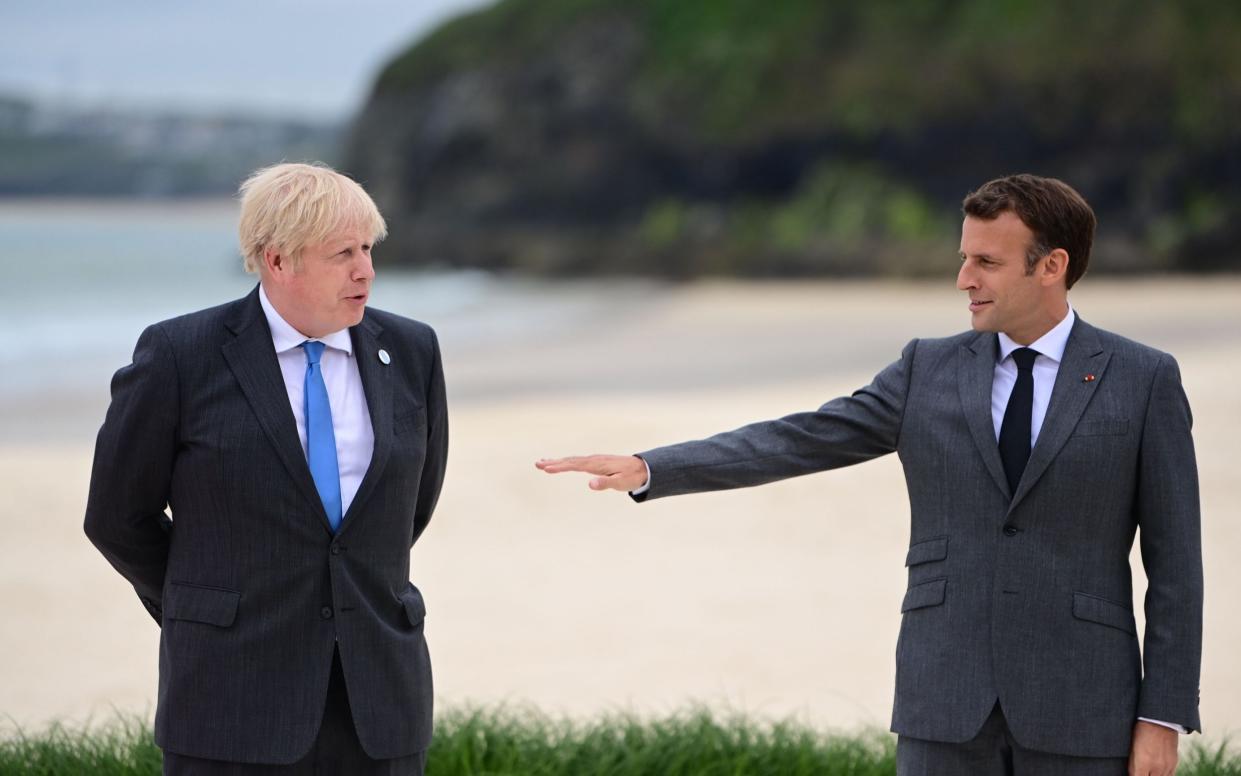 Boris Johnson and Emmanuel Macron at the G7 in Cornwall. UK-French relations are at a low ebb after tensions over Brexit and the Aukus row. - Shutterstock