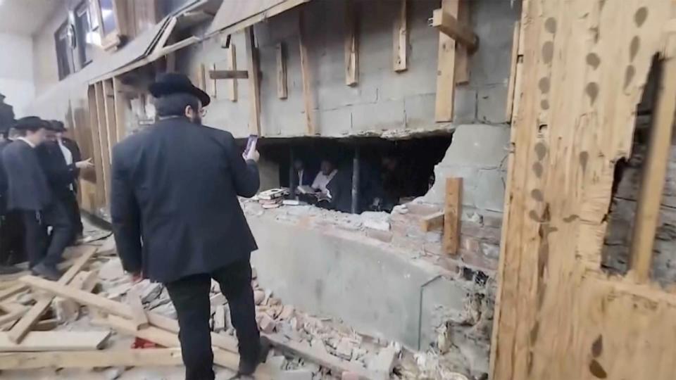 PHOTO: Police officers are seen inspecting a tunnel beneath the Chabad-Lubavitch world headquarters, Jan. 8, 2024, in Brooklyn, N.Y. (AP )