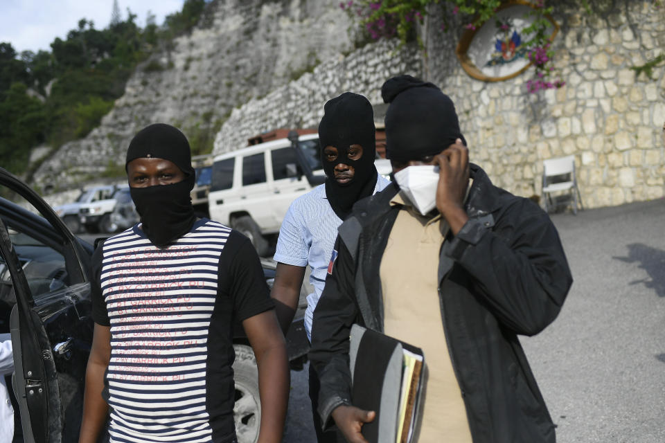 Police officers investigating the assassination of President Jovenel Moise leave his residence in Port-au-Prince, Haiti, Thursday, July 15, 2021. President Moise was assassinated in his home on July 7. (AP Photo/Matias Delacroix)