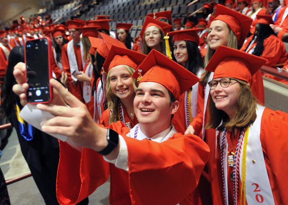 Michael McDonnell, center, takes a group selfie.