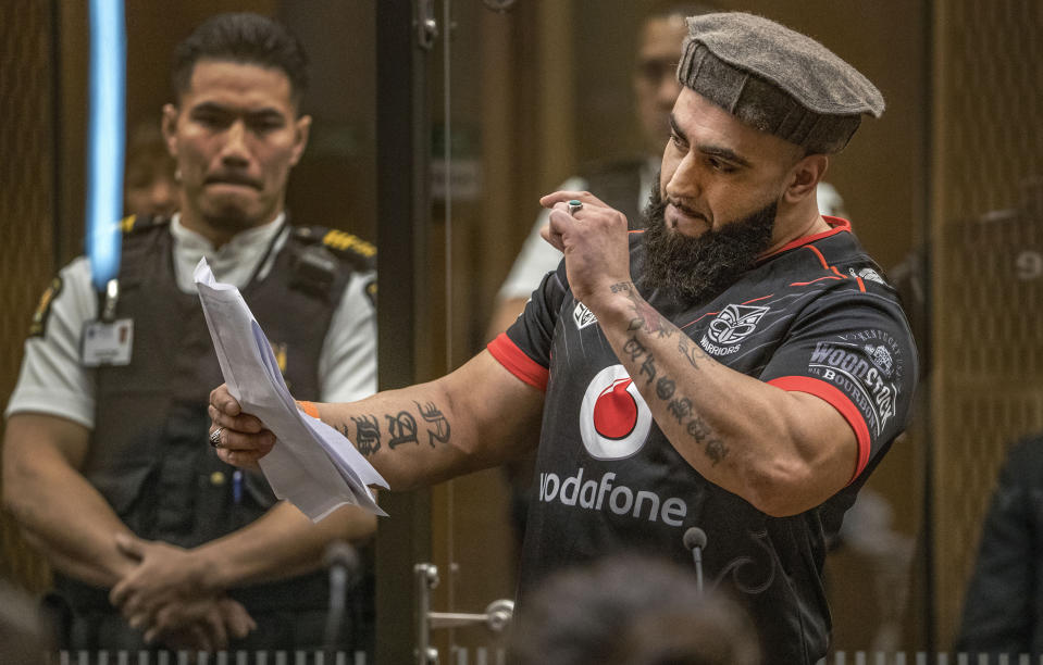 Ahad Nabi gestures as he reads a victim impact statement during the sentencing hearing for Australian Brenton Harrison Tarrant at the Christchurch High Court after Tarrant pleaded guilty to 51 counts of murder, 40 counts of attempted murder and one count of terrorism in Christchurch, New Zealand, Wednesday, Aug. 26, 2020. More than 60 survivors and family members will confront the New Zealand mosque gunman this week when he appears in court to be sentenced for his crimes in the worst atrocity in the nation's modern history. (John Kirk-Anderson/Pool Photo via AP)