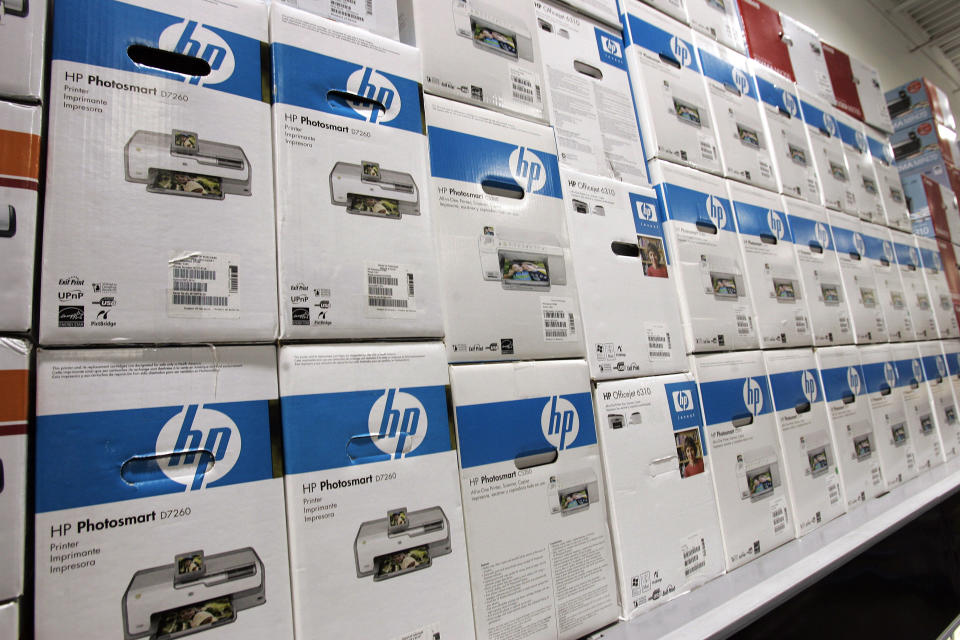 Boxes of Hewlett Packard printers are stacked up at a Best Buy store in Mountain View, Calif., Thursday, Nov. 15, 2007. Hewlett-Packard Co., the world's biggest PC seller, is scheduled to report fourth-quarter financial results after the market closes on Monday, Nov. 19, 2007. Wall Street is expecting another comfortably profitable quarter from the Palo Alto-based technology giant amid continued healthy demand for its crown jewel product _ lucrative printer ink _ and surging global PC sales, particularly for laptop computers.(AP Photo/Paul Sakuma)