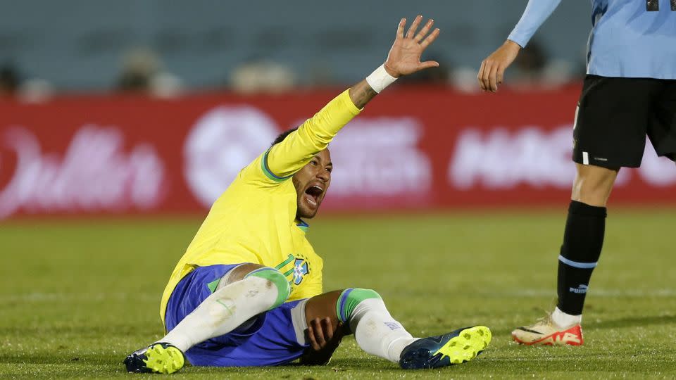 Neymar reacts after tearing his left ACL and meniscus. - Andres Cuenca/Reuters