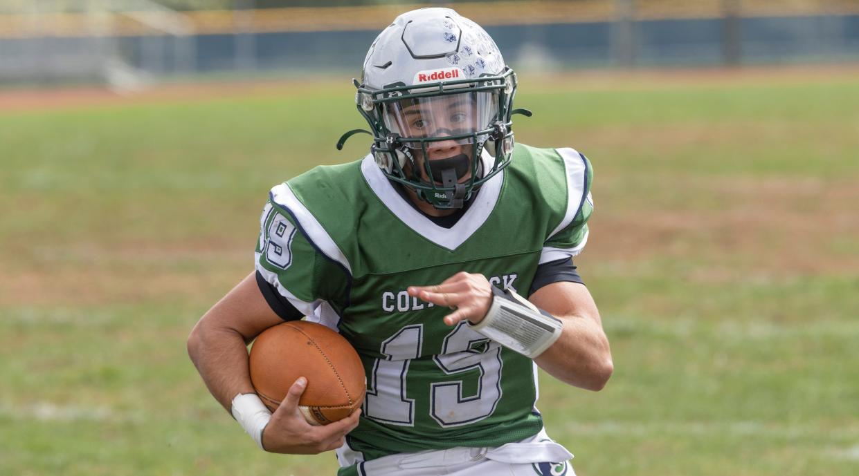 Colts Neck Dom Beninato take the ball around left side in first quarter action. Colts Neck football defeats Howell in Colts Neck, NJ on October 8, 2022. 