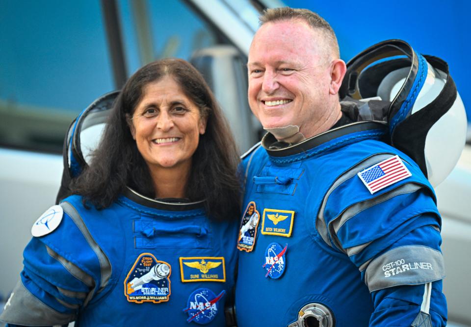 Butch Wilmore and Suni Williams, wearing Boeing spacesuits, depart the Neil A. Armstrong Operations and Checkout Building at Kennedy Space Center for Launch Complex 41 at Cape Canaveral Space Force Station in Florida to board the Boeing CST-100 Starliner spacecraft.