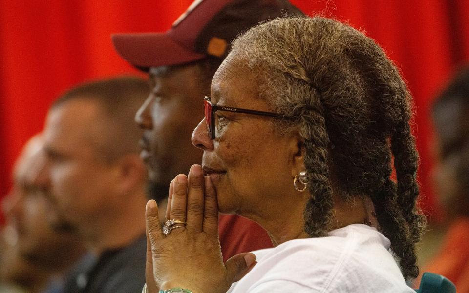 Marilyn Savage reacts while watching a dance recital during the Dunbar Neighborhood Watch & Community Partners 11th annual Community Prayer Service at the Dunbar Community School on Thursday, Feb. 29, 2024. Dozens gathered for the event that featured prayer for community and nation, youth, law enforcement, clergy and bereaved families that have lost someone to a violent crime. The event ended with a candlelight vigil.