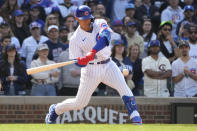 Chicago Cubs' Miguel Amaya swings into a pinch-hit RBI single, in his first major league at bat, during the eighth inning of a baseball game against the Miami Marlins on Saturday, May 6, 2023, in Chicago. (AP Photo/Charles Rex Arbogast)