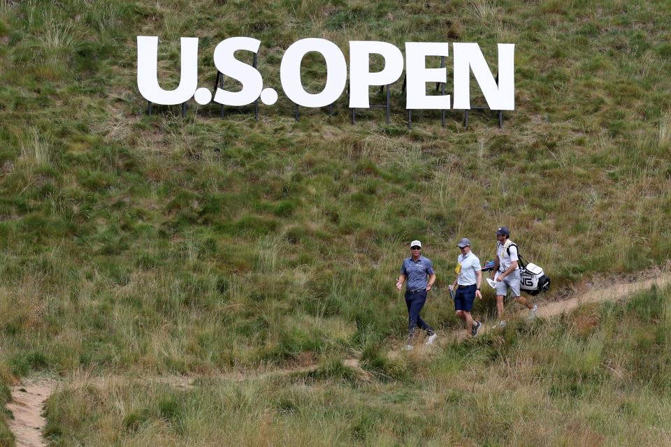 Jun 12, 2023; Los Angeles, California, USA; Seamus Power (left) walks on the fourth hole during a practice round of the U.S. Open golf tournament at the Los Angeles Country Club . Mandatory Credit: Kiyoshi Mio-USA TODAY Sports