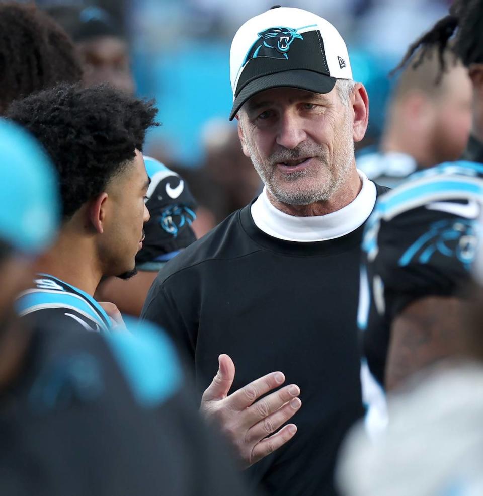 Carolina Panthers quarterback Bryce Young, left and head coach Frank Reich, right, talk along the team’s bench during second half action at Bank of America Stadium in Charlotte, NC on Sunday, November 19, 2023. The Dallas Cowboys defeated the Panthers 33-10.
