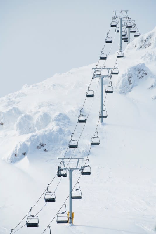 The lift line against a backdrop of rime-encased rock outcroppings.<p>Fernie Alpine Resort/Mark Shannon</p>