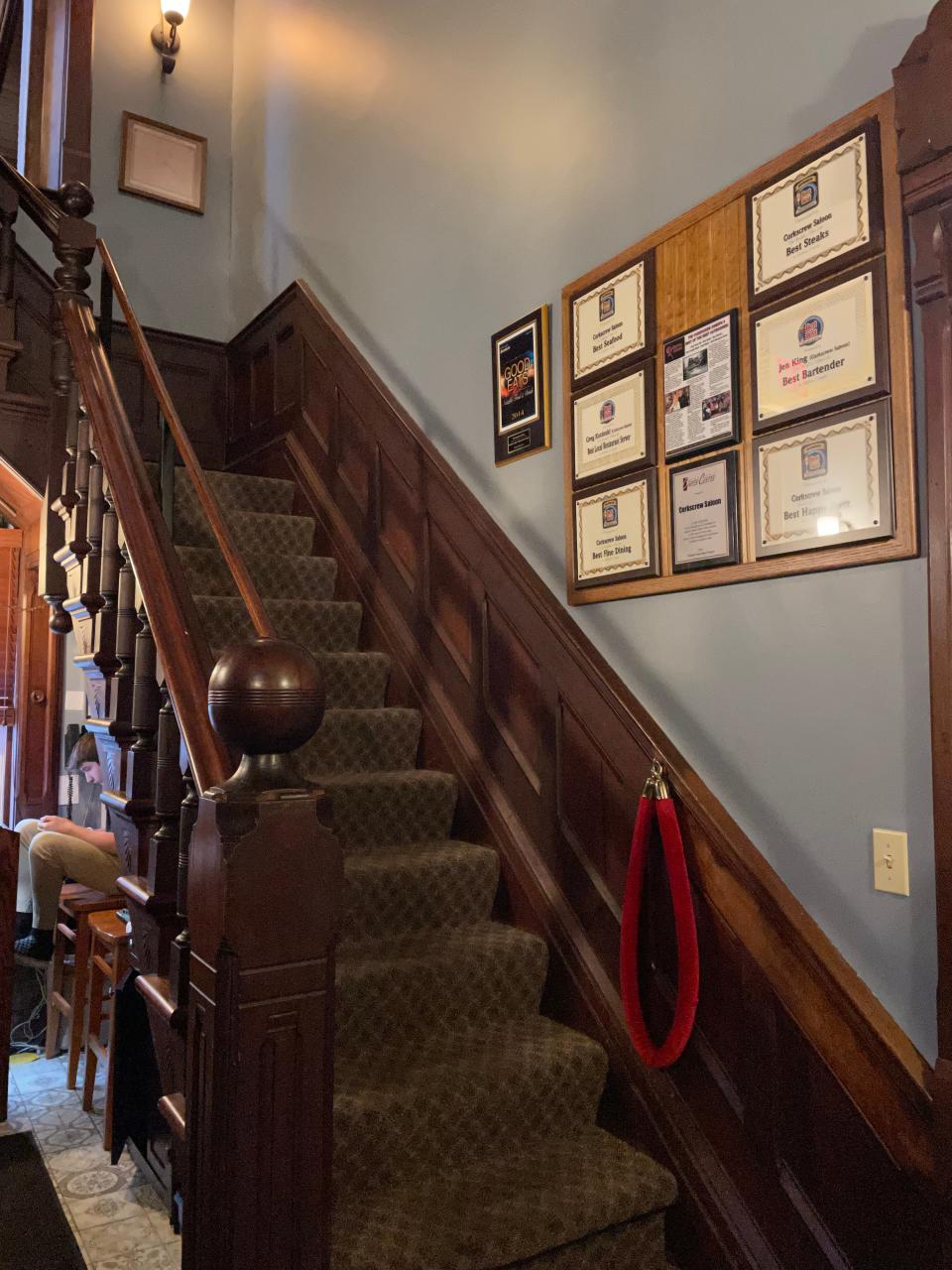 The grand staircase inside of the Corkscrew Saloon in Medina.