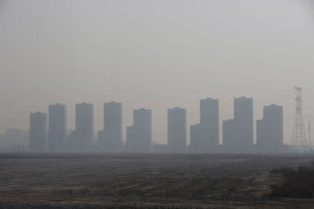 Buidlings are seen on a polluted day in Tianjin, China, March 2, 2016. REUTERS/Kim Kyung-Hoon