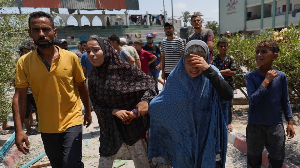 Palestinians flee from a school where they had taken refuge, after it was hit by an Israeli strike, in Deir el-Balah in the central Gaza Strip on July 27, 2024, amid the ongoing conflict between Israel and the Palestinian militant group Hamas. - Bashar Taleb/AFP/Getty Images