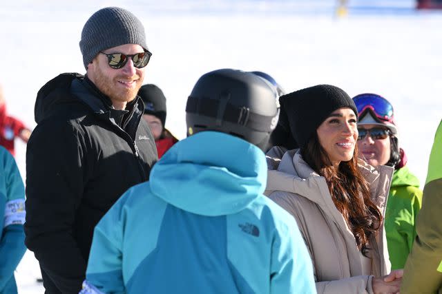 <p>Karwai Tang/WireImage</p> Prince Harry and Meghan Markle attend the Invictus Games Winter Training Camp on Feb. 15, 2024