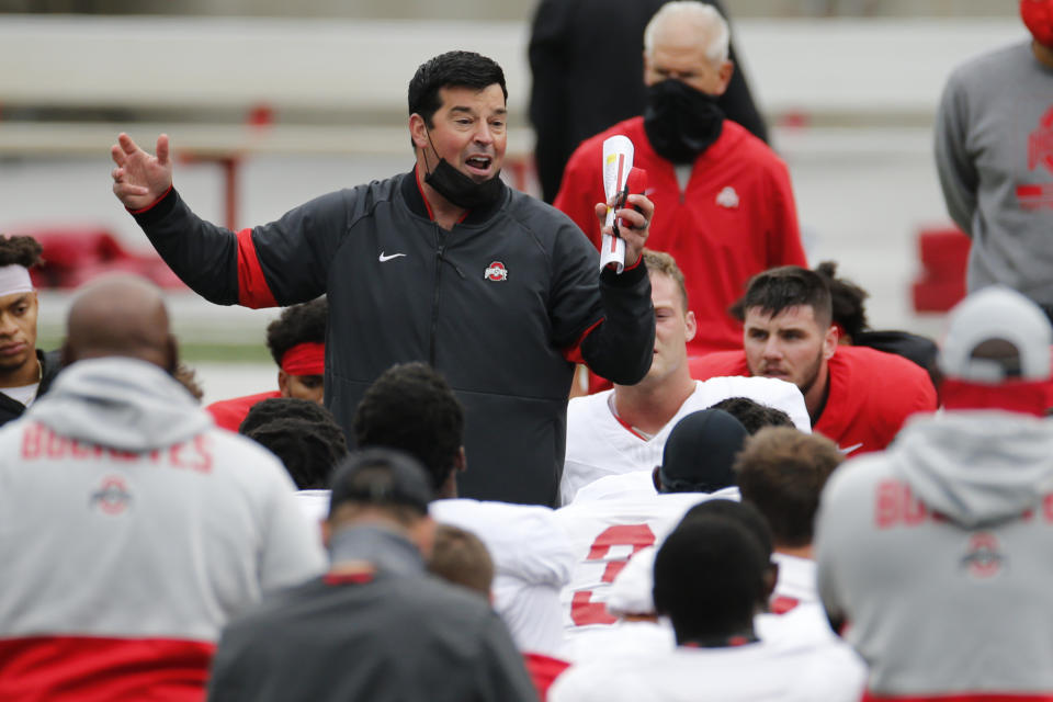 FILE - In this Saturday, Oct. 3, 2020, file photo, Ohio State head coach Ryan Day talks to his team during their NCAA college football practice, in Columbus, Ohio. As Alabama, Ohio State, Clemson, Oregon, Notre Dame, Oklahoma and Florida prepared to play for conference championships, they signed top-10 recruiting classes for 2021 they hope to fuel their next title contenders..(AP Photo/Jay LaPrete, File)