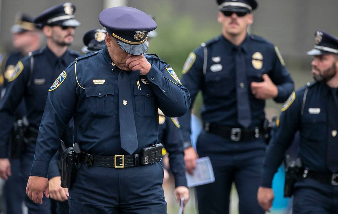 Fuquay-Varina Police Officer B. Medina leaves the funeral service for Wake County Deputy Ned Byrd at Providence Baptist Church on Friday, August 19, 2022 in Raleigh,