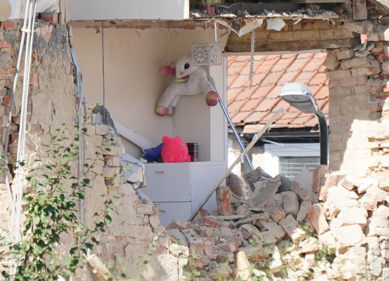 Soft toys and a lampost are seen in an exposed room of a property in Galpin's Road in Thornton Heath, south London, where a house collapsed amid a fire and explosion. A four-year-old girl is feared missing after a terraced home collapsed following an explosion, according to neighbours. Picture date: Monday August 8, 2022.