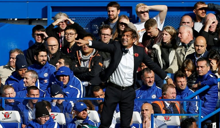 Chelsea's head coach Antonio Conte shouts instructions to his players from the touchline during their match against Watford at Stamford Bridge in London on October 21, 2017