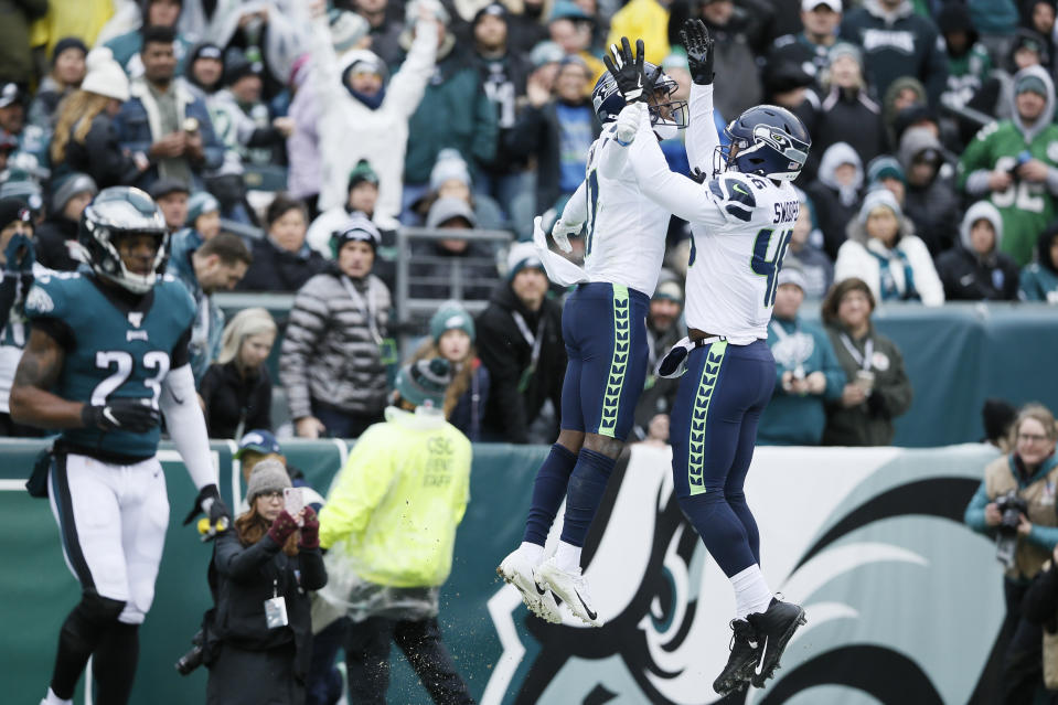 Seattle Seahawks' Malik Turner (17) and Tyrone Swoopes (46) celebrate after a touchdown by Turner during the first half of an NFL football game against the Philadelphia Eagles, Sunday, Nov. 24, 2019, in Philadelphia. (AP Photo/Michael Perez)