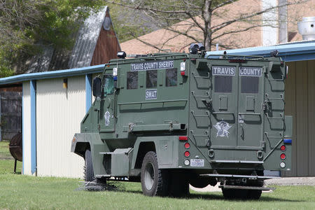 A SWAT vehicle is seen parked in a neighborhood containing the home where the bomber was suspected to have lived in Pflugerville, Texas, U.S., March 21, 2018. REUTERS/Loren Elliott