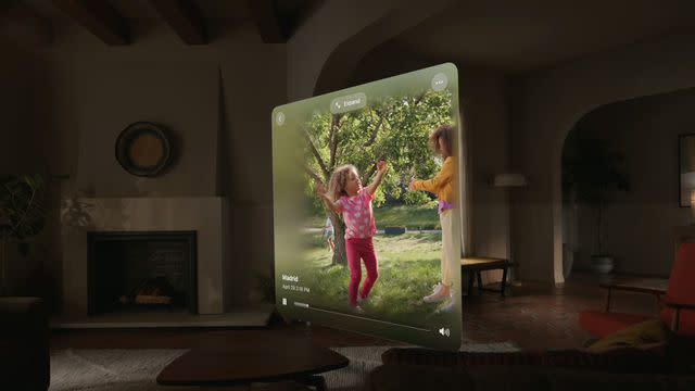 &lt;p&gt;Apple&lt;/p&gt; Looking at photos using Apple Vision Pro mixed reality headset.