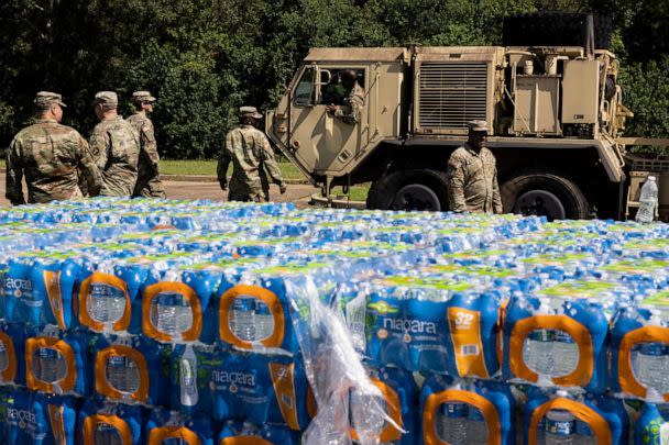 PHOTO: JACKSON, MS - SEPTEMBER 01: A truck carrying non-potable water arrives at Thomas Cardozo Middle School where personnel from the Mississippi National Guard were also handing out bottled water on September 01, 2022 in Jackson, Mississippi. (Brad Vest/Getty Images)