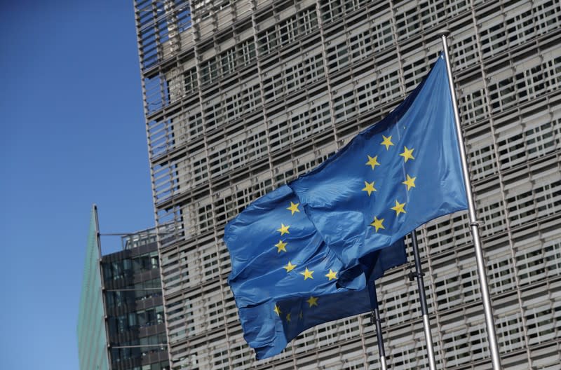 FILE PHOTO: European Flags flutter outside the European Commission's headquarters ahead of the European Union leaders summit, in Brussels