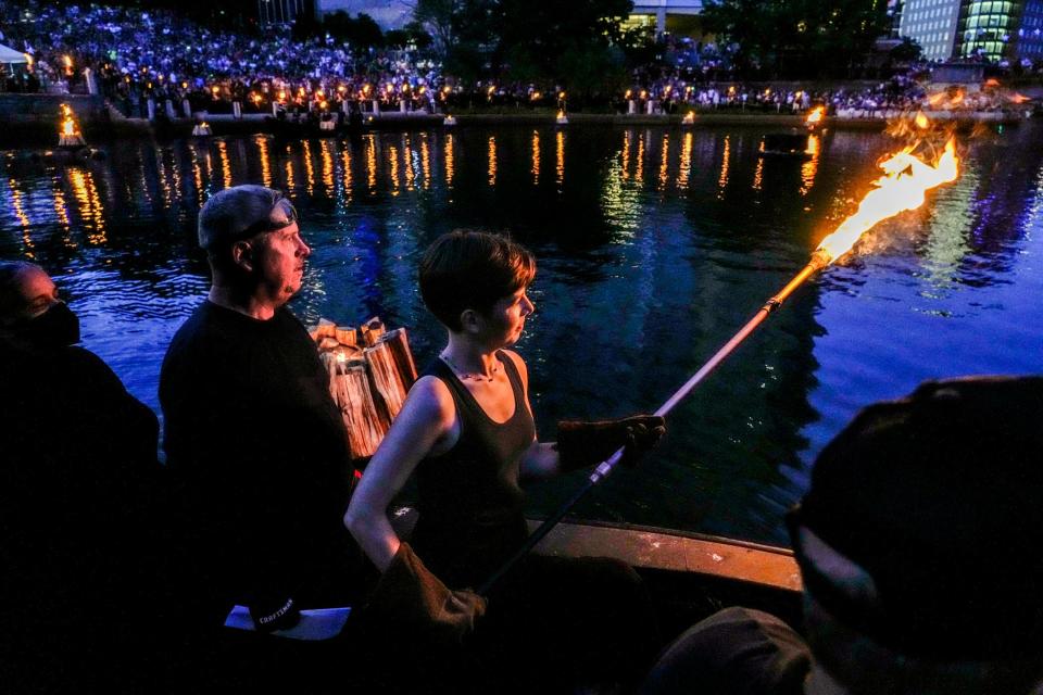 Amy Russo makes her maiden voyage as a WaterFire Providence volunteer at the July 30 lighting.