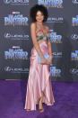 <p>The 21-year-old wears a colourful silk gown. <em>[Photo: Getty]</em> </p>