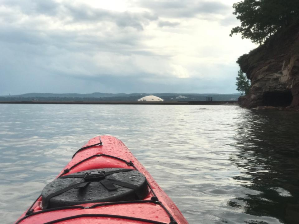 Lake Superior around Marquette is great spot for Kayaking, especially with a guide. In the foreground, you can see the Superior Dome.